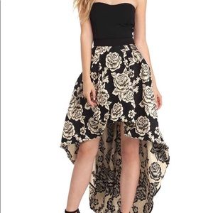 black dress with gold rose detailed skirt